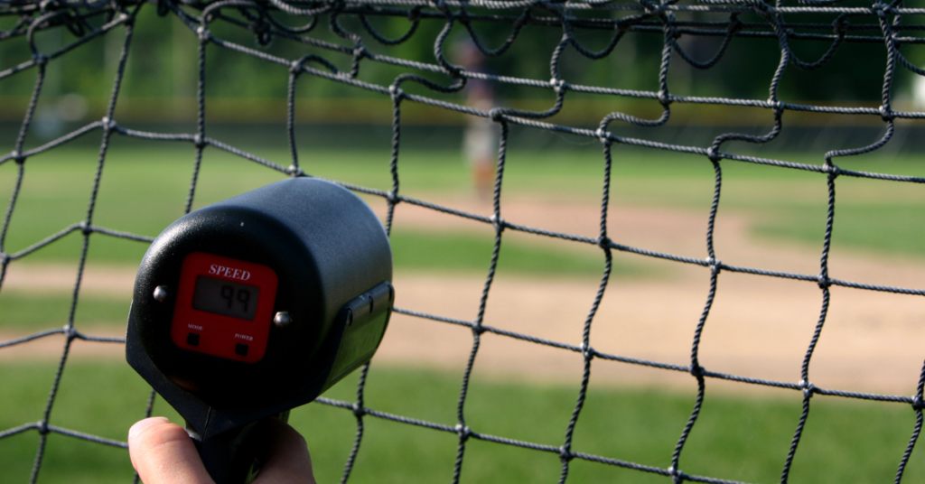 Radar gun showing the speed of a pitch being 99mph at a baseball game.