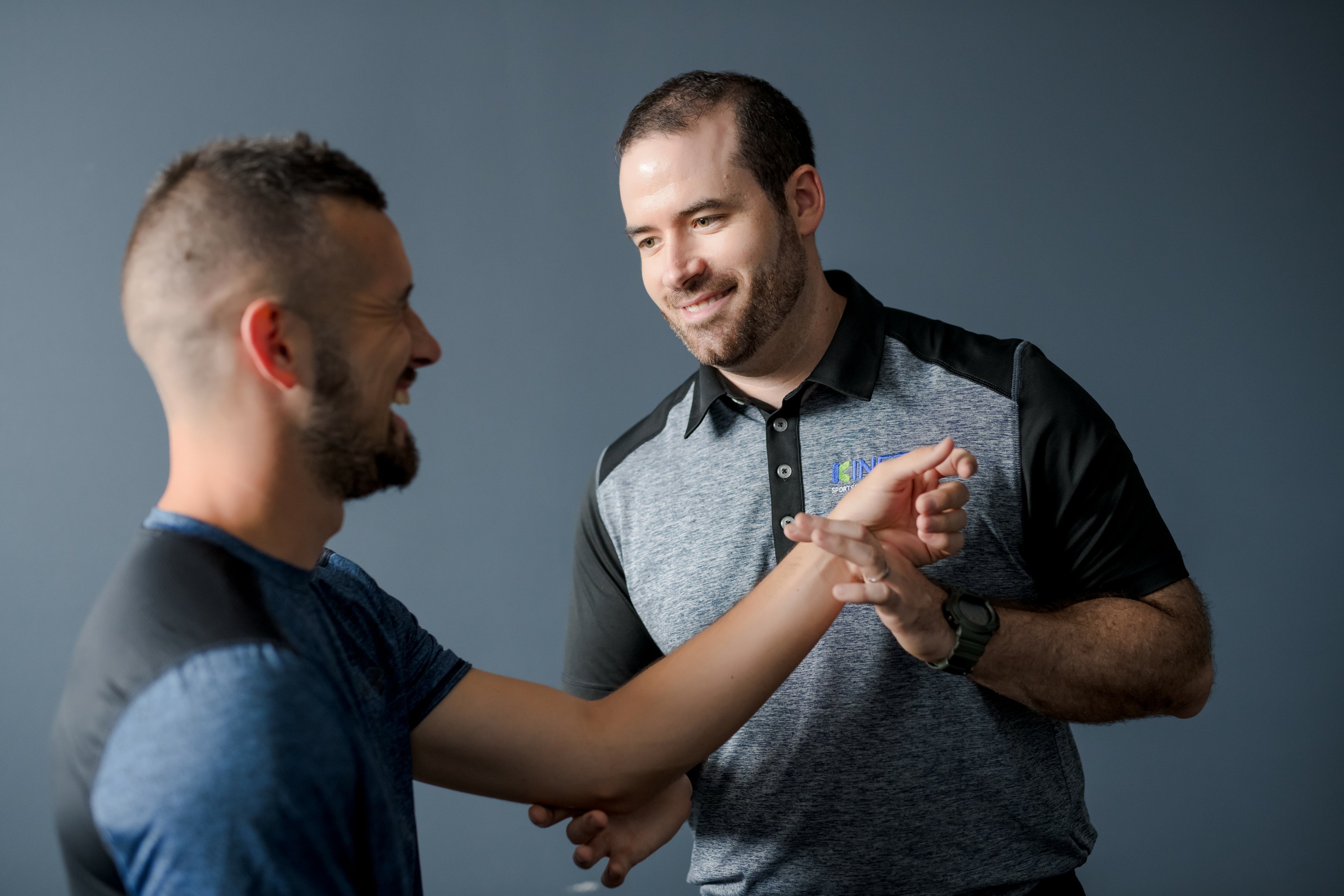 Physical therapist discussing plan and working with patient.