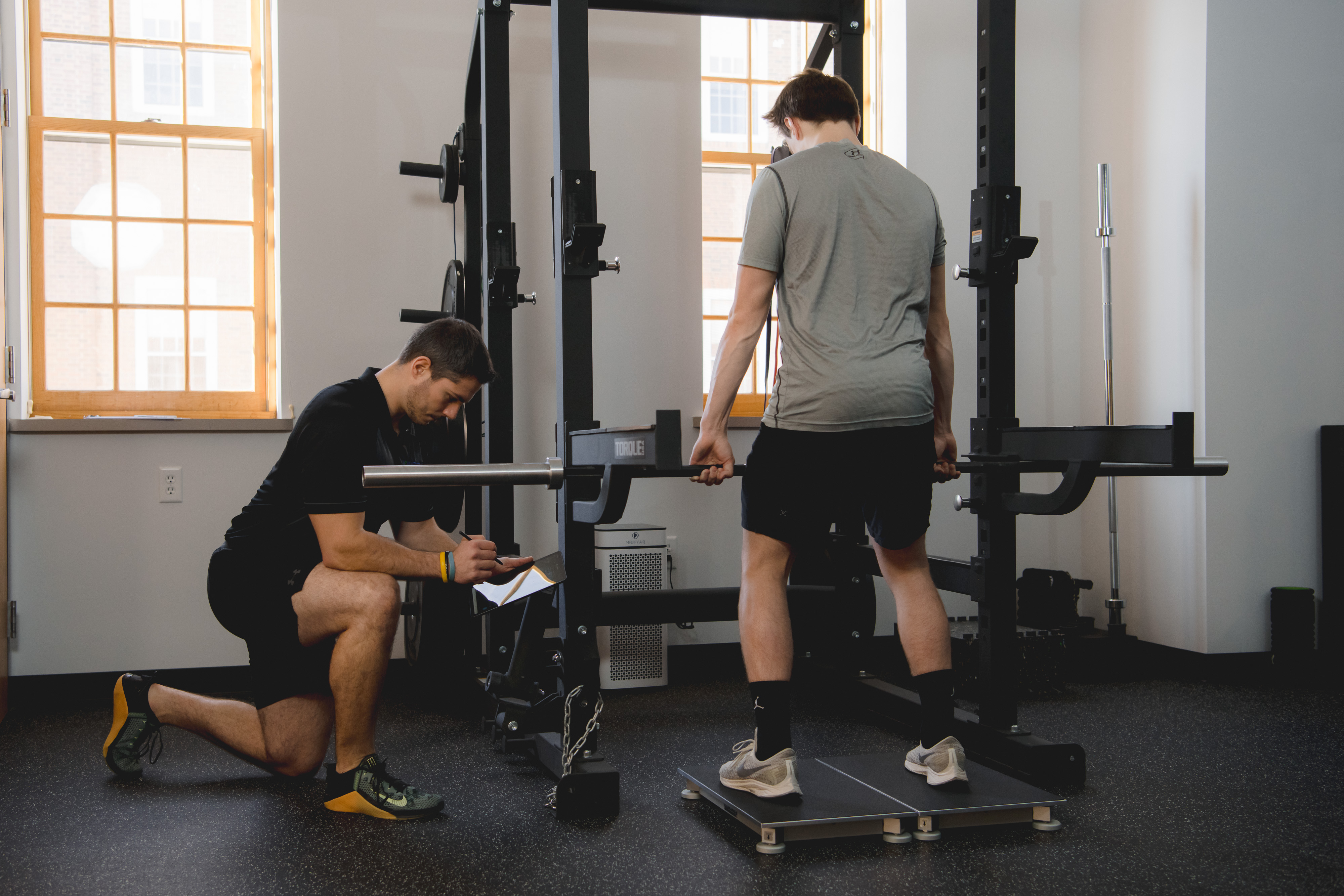 Athlete assessing strength during sports physical therapy.