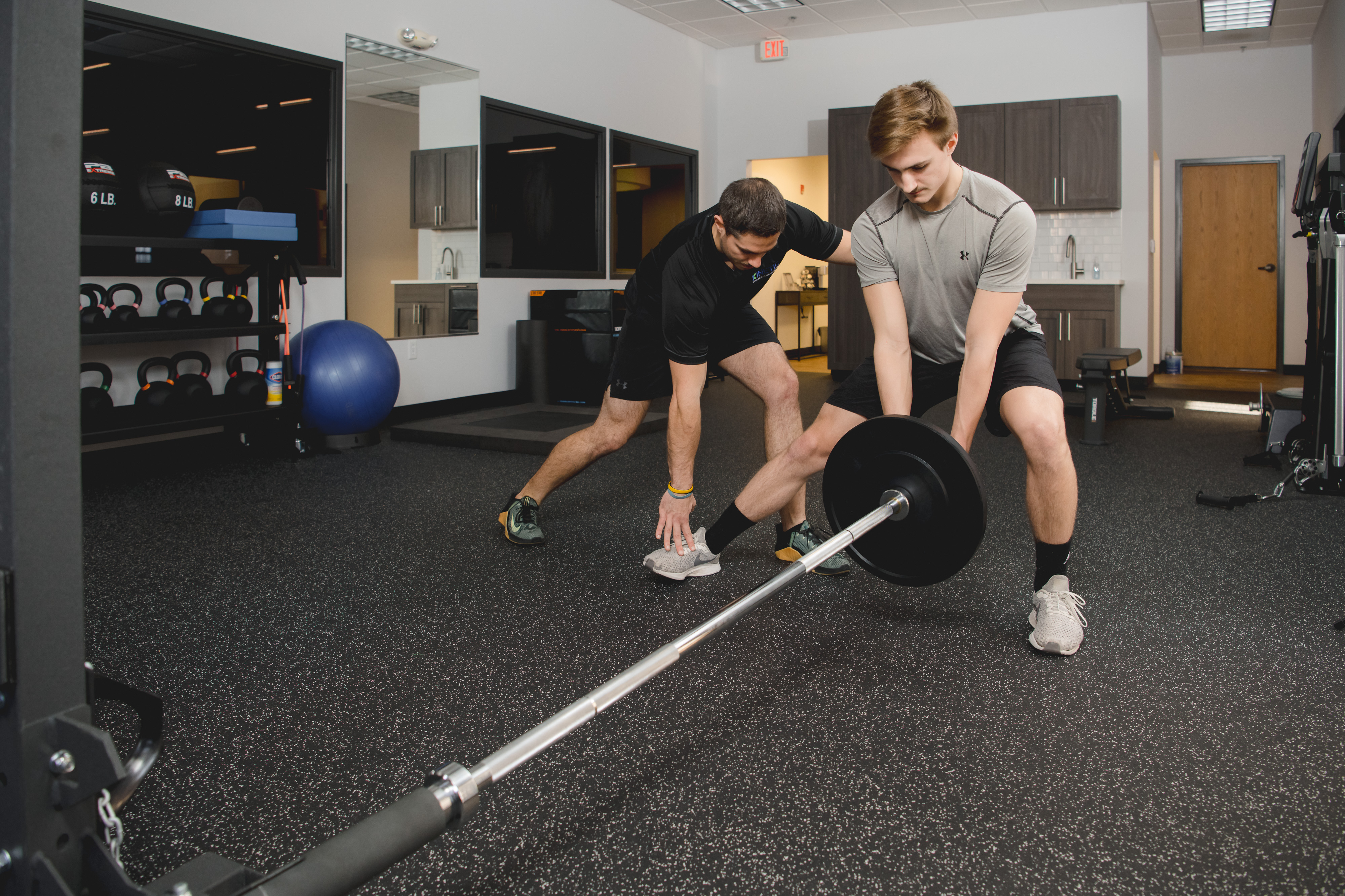 Physical therapist helping patient with exercises.