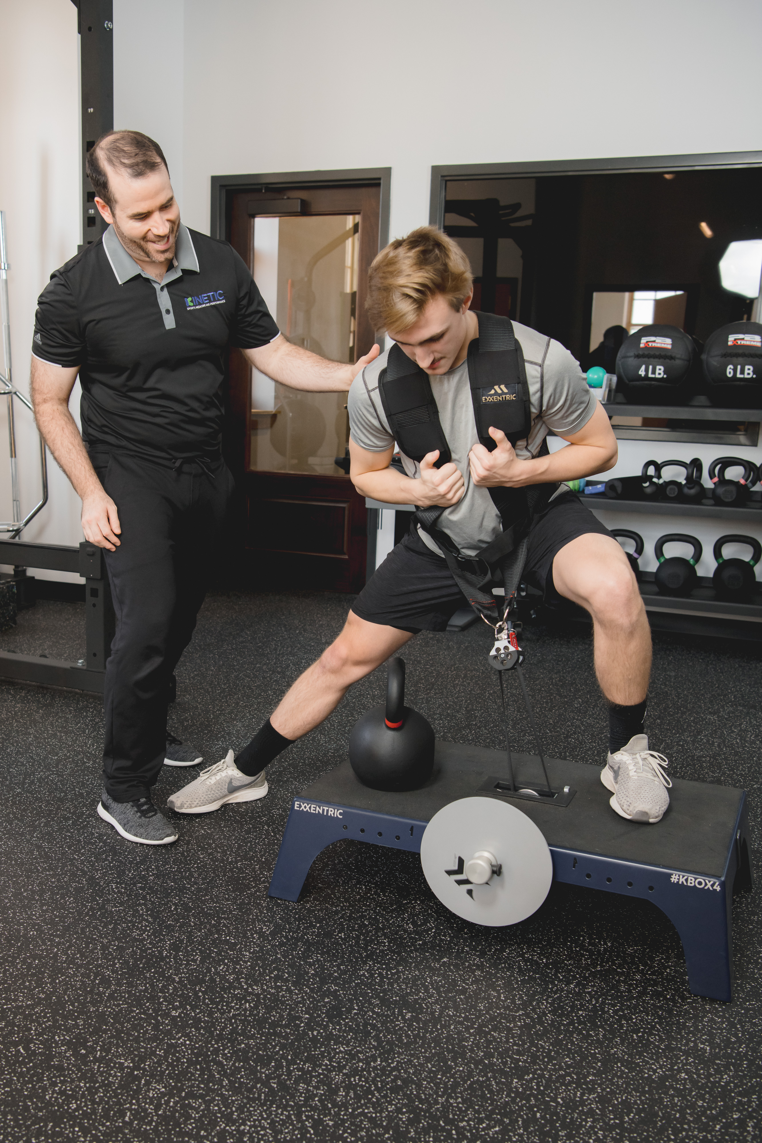 Physical therapist working on exercises with patient.