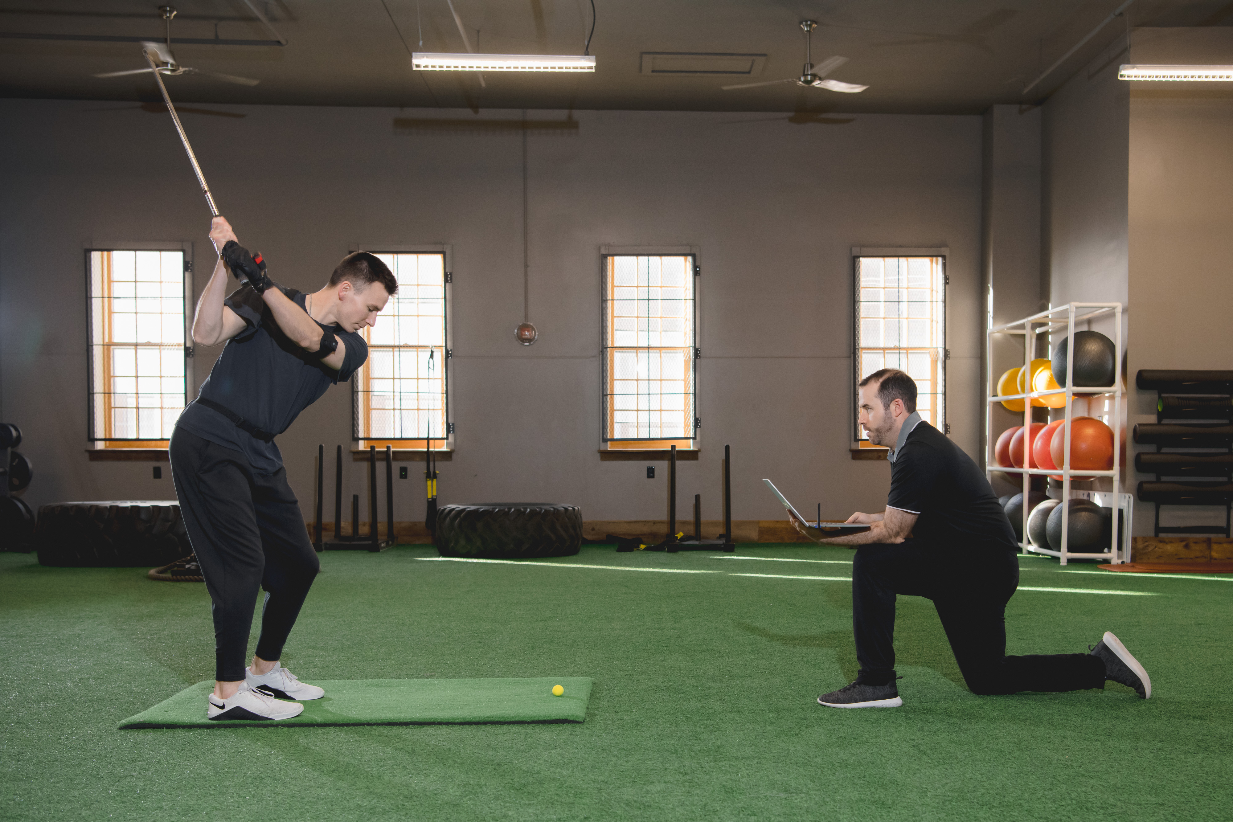 Golfer enhancing his performance at sports physical therapy.