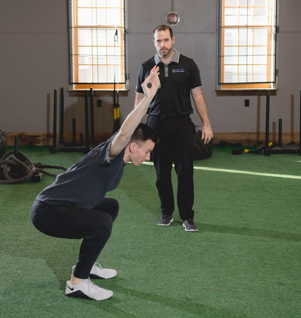 Golfer working on range of motion during sports physical therapy.